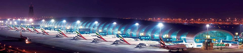 Lineup of Emirates aircraft at an airport