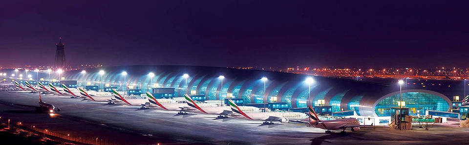 Lineup of Emirates aircraft at an airport