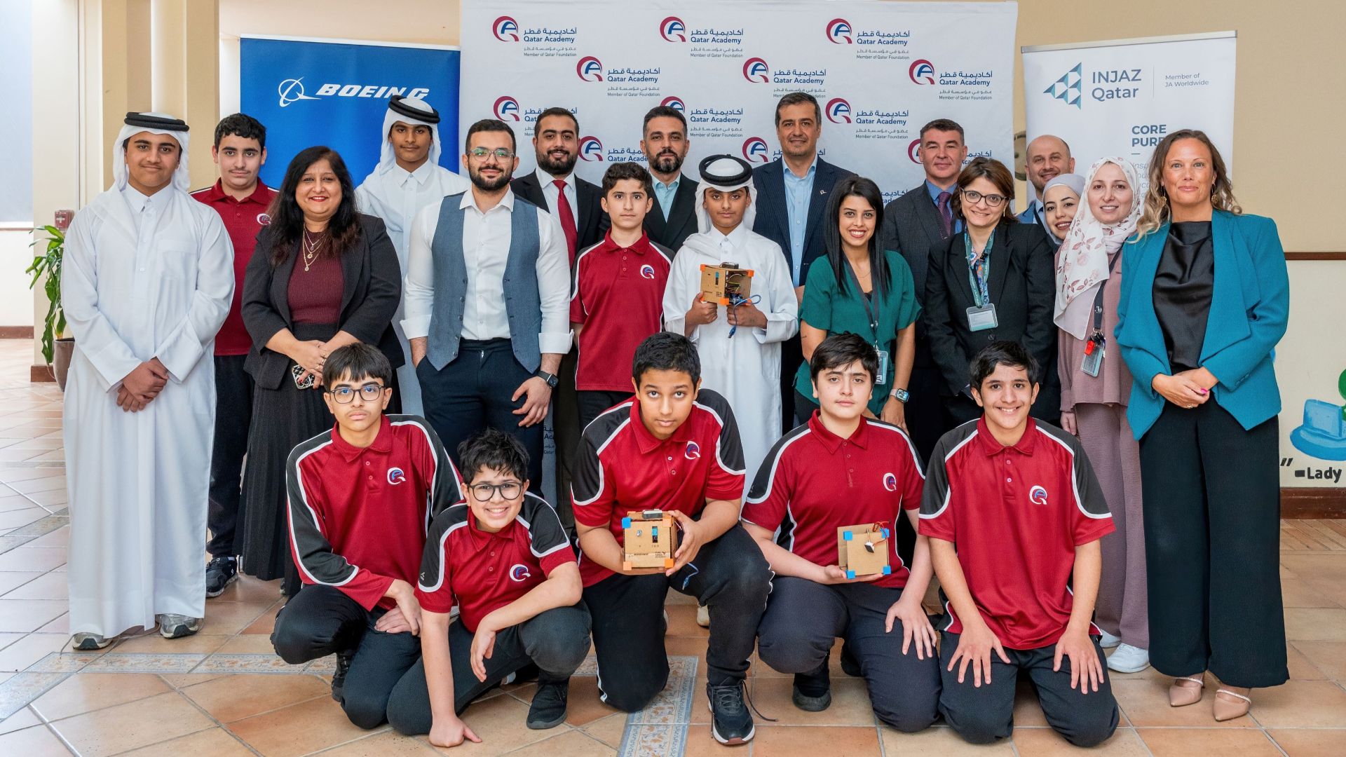 Qatar Academy Doha students, educators, INJAZ Qatar and Boeing leaders pose for a group photo on June 16, 2026.